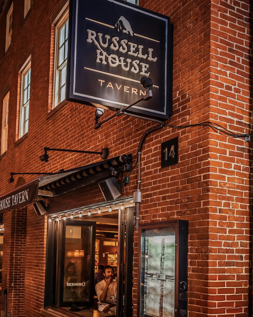 Exterior photo of the Russell House Tavern's signage