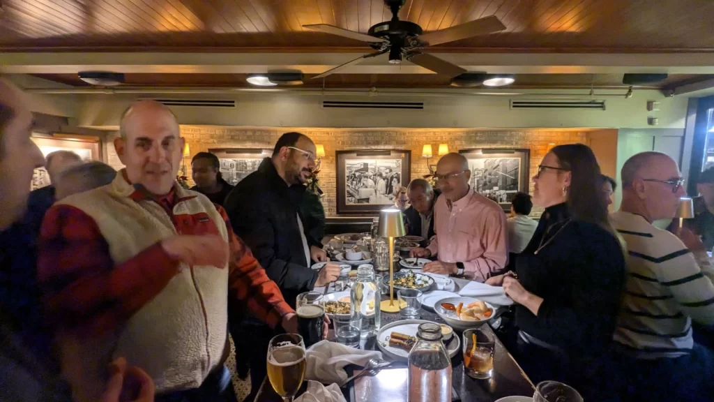 Last Boston WordPress meetup event of the year. Photo of attendees chatting and networking
